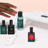 A hand with red-painted nails reaches for the Manucurist Discovery Kit—featuring nail polish, a vitaminized base coat, a white LED nail lamp, and white clips—essentials for an ultra-glossy manicure on a light surface.