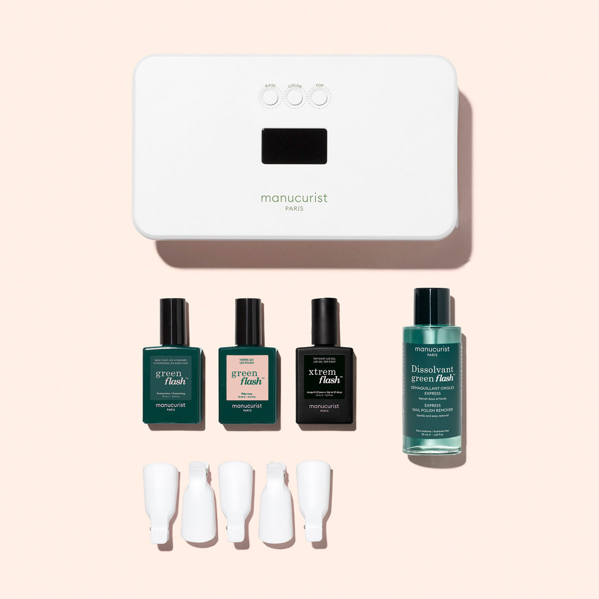 Manucurist Discovery Kit - Soap Nails LED Gel Polish including an LED lamp, three small bottles of long-lasting gel polish, a bottle of nail polish remover, and four silicone nail clips.