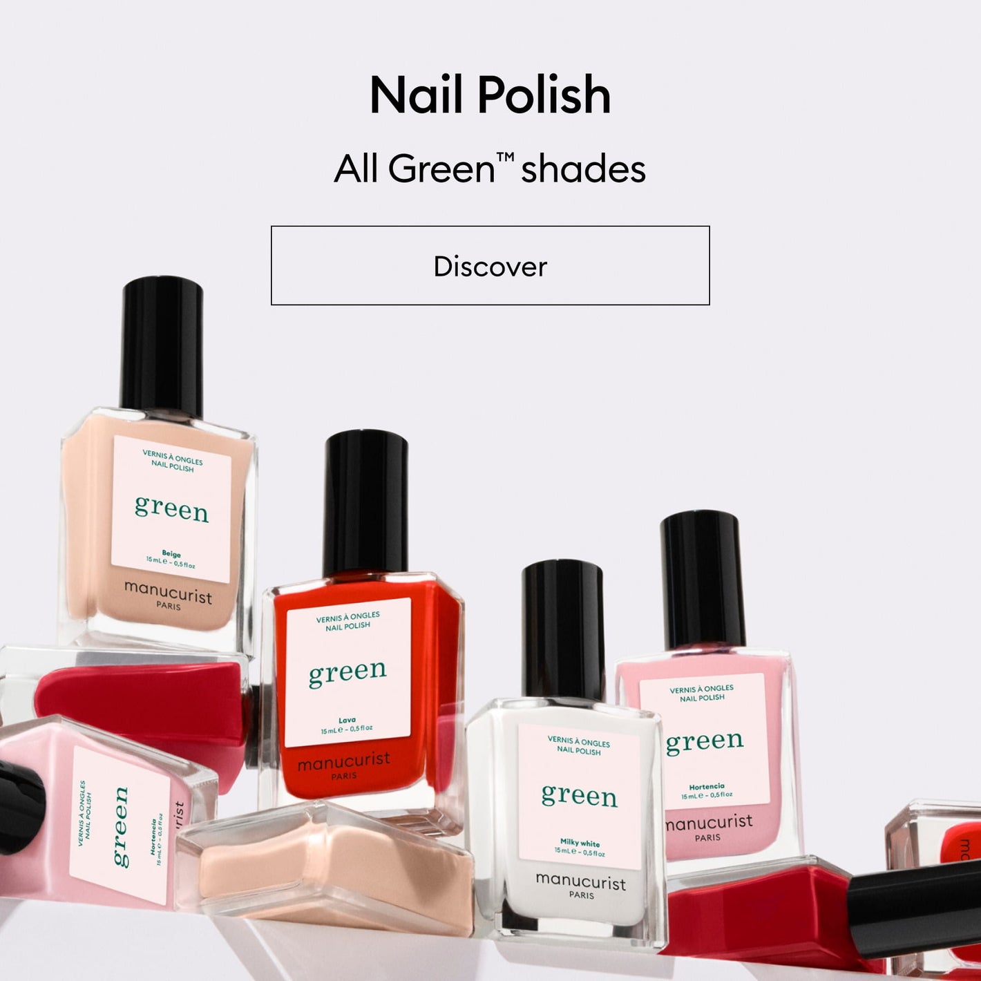 Bottles of Manucurist Paris nail polish in various colors and labeled green are arranged on a white background with the text Nail Polish - All Green shades - Discover above them.