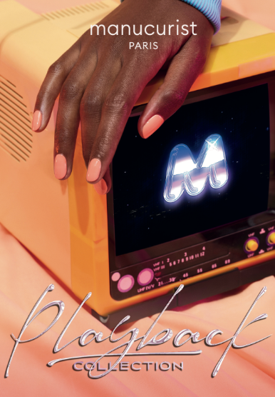 A hand with a glossy peach manicure rests on a retro yellow TV displaying a glowing M logo. "Manucurist-test" appears at the top and "Leaflet Collection Playback" is shown at the bottom.