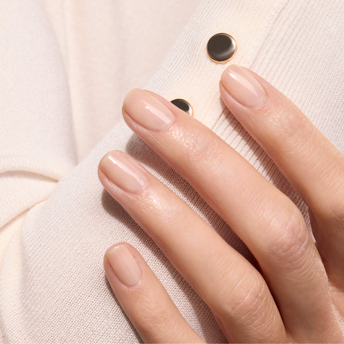 A close-up of a hand with neatly manicured nails painted in Manucurist&