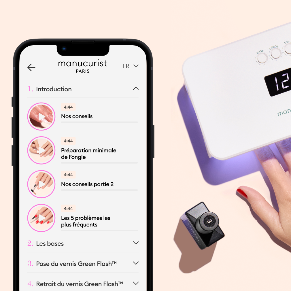 A smartphone displays a manicure tutorial app, showing lesson topics, beside a hand using a nail lamp on a pastel background with manicure tools nearby.