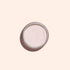 Un pot rond en métal de Pink Glazed Effect Powder Manucurist, au subtil fini nacré, vu de dessus sur un fond beige clair.