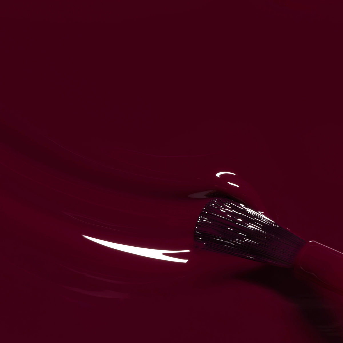 A close-up of a brush applying Manucurist&