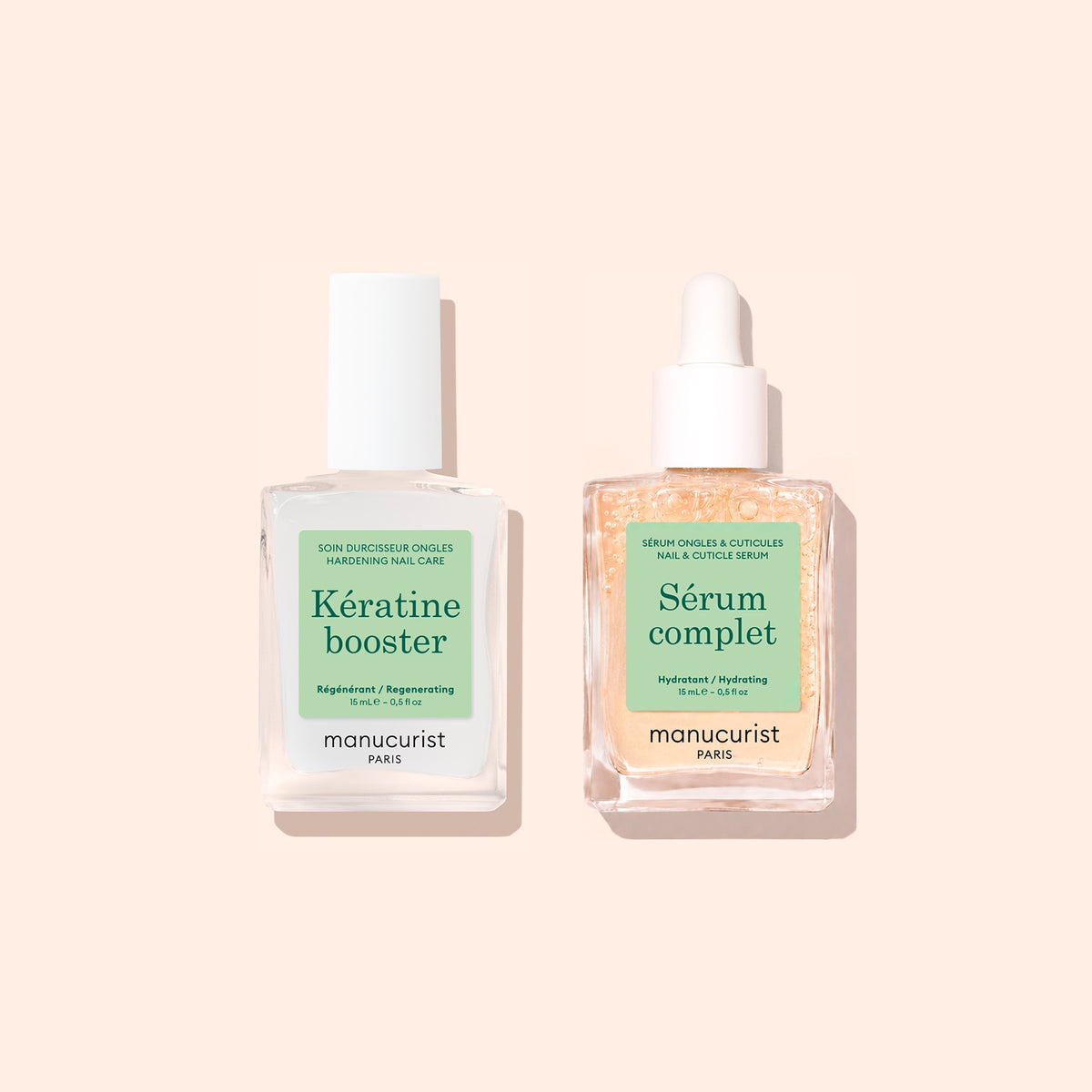 Deux flacons en verre transparent du set Basic Routine - Soft Nails de Manucurist sont présentés sur un fond beige. Le flacon de gauche est étiqueté Kératine Booster, tandis que celui de droite est doté d’une pipette et est étiqueté Sérum Complet. Ces deux soins de manucure sont parfaits pour compléter votre routine de soin des ongles, idéals pour toutes celles et ceux qui souhaitent réparer et renforcer les ongles mous.