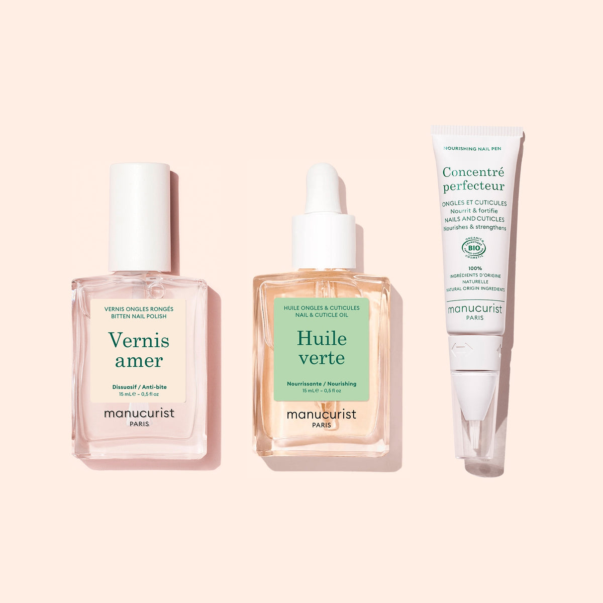 Le coffret Manucurist Starter Routine - Bitten Nails, comprenant un vernis à ongles rose, un flacon compte-gouttes d’huile pour les ongles et les cuticules, et une crème de soin des ongles dans un tube blanc sur fond rose pâle, est conçu pour favoriser la repousse des ongles et redonner de la beauté aux ongles rongés.