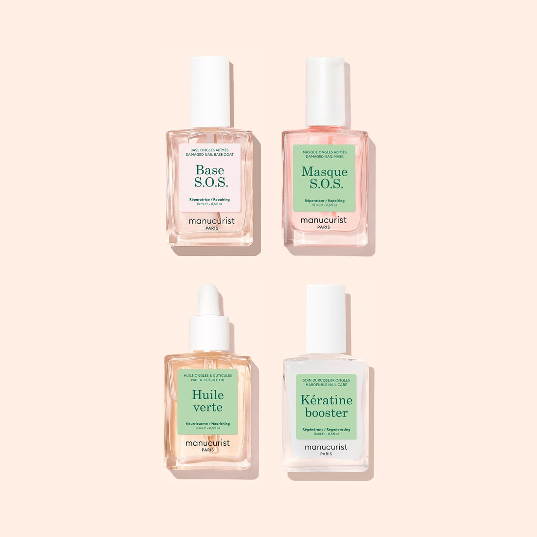 Four manicure treatment bottles from Manucurist’s Basic Routine – Damaged Nails set arranged in a square on a light beige background, perfect for nail repair and strengthening. Labels read: Base S.O.S., Masque S.O.S., Huile verte, and Kératine booster. The clear bottles feature green and pink labels—an ideal set to help restore brittle nails.