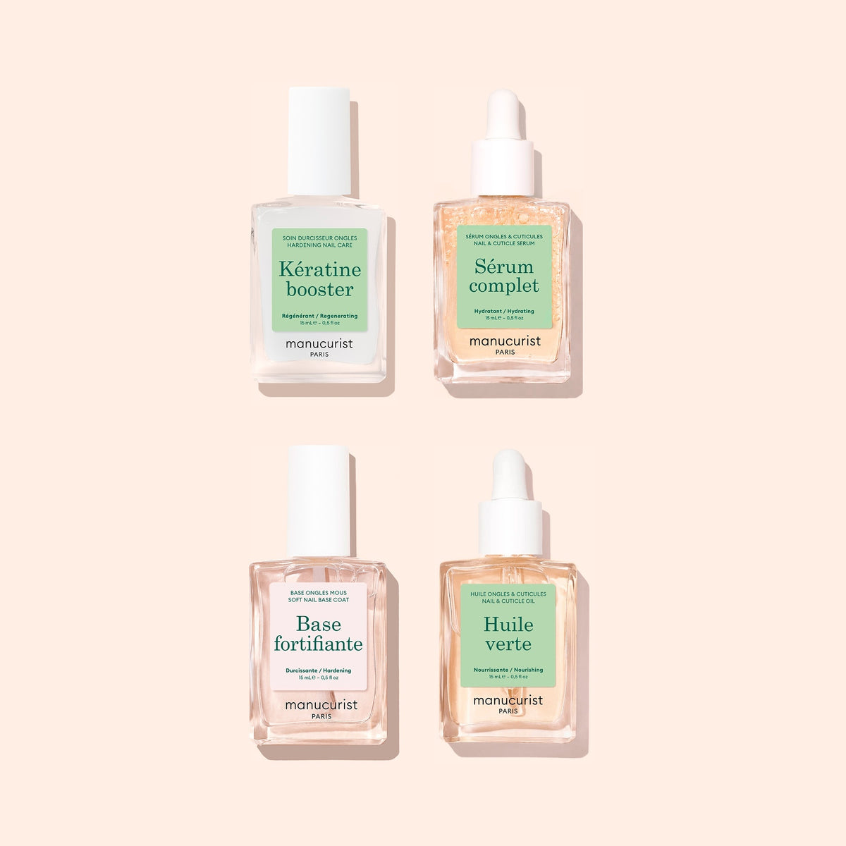 Quatre flacons de soin manucure du coffret Routine Essentielle - Ongles mous de Manucurist, dotés de bouchons blancs et d&