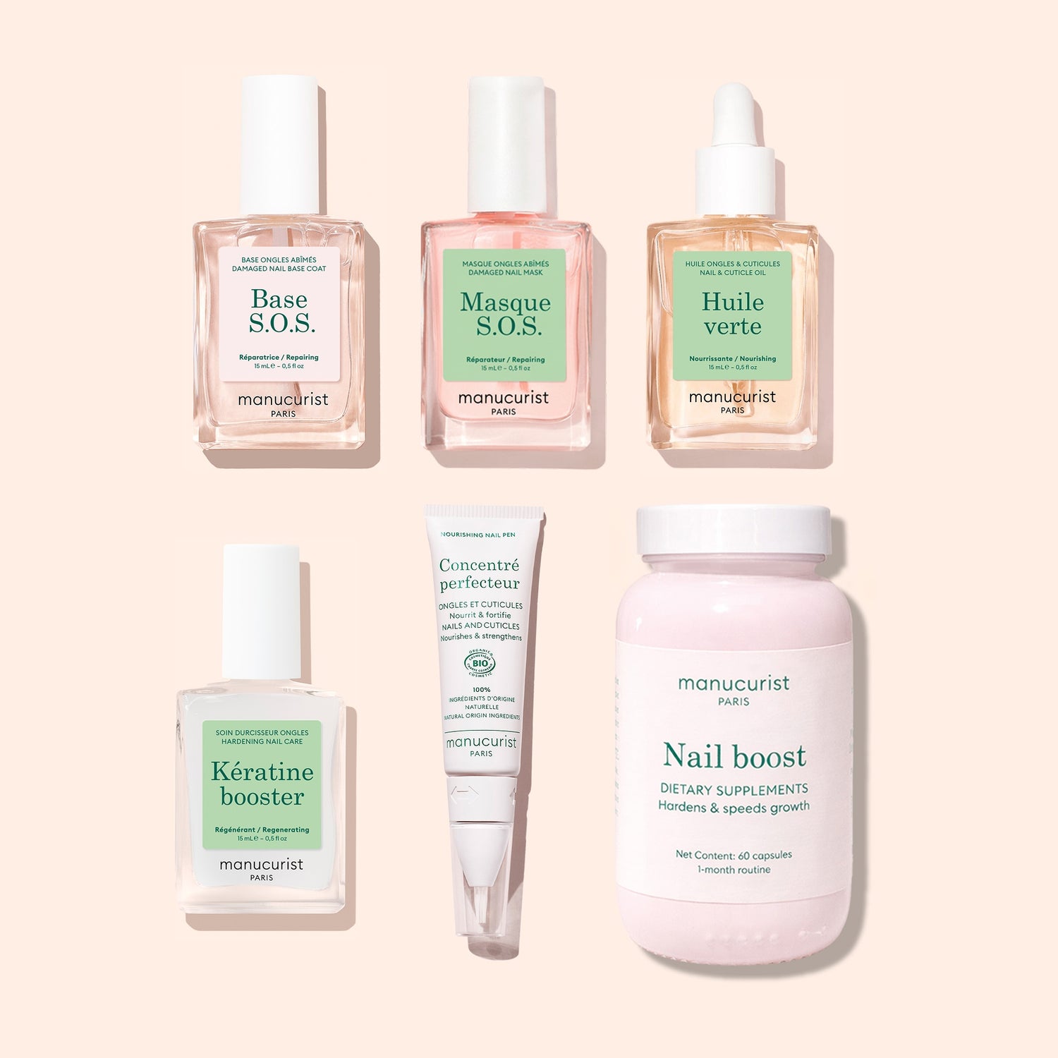 The Manucurist Ultimate Routine - Damaged Nails set, featuring six nail care products for repair—including Base S.O.S., Masque S.O.S., Huile verte cuticle oil, Kératine booster nail strengthener, Concentre perfecteur cream, and Nail boost dietary supplements—is arranged on a beige background.