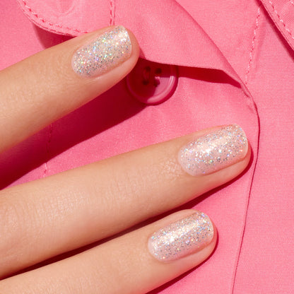 Three fingers with short nails painted in Manucurist&