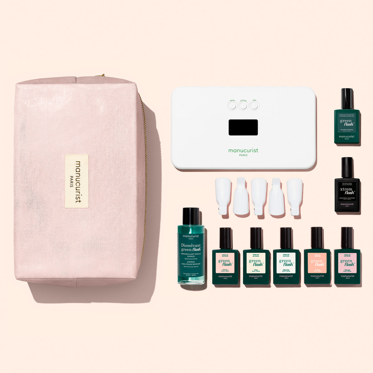 The Manucurist Super Starter Kit - Soap Nails LED Gel Polish includes a light pink zippered pouch, a white LED lamp, remover, five colored polishes, a vitaminized base coat, a top coat, and five white nail clips for an ultra-glossy manicure.