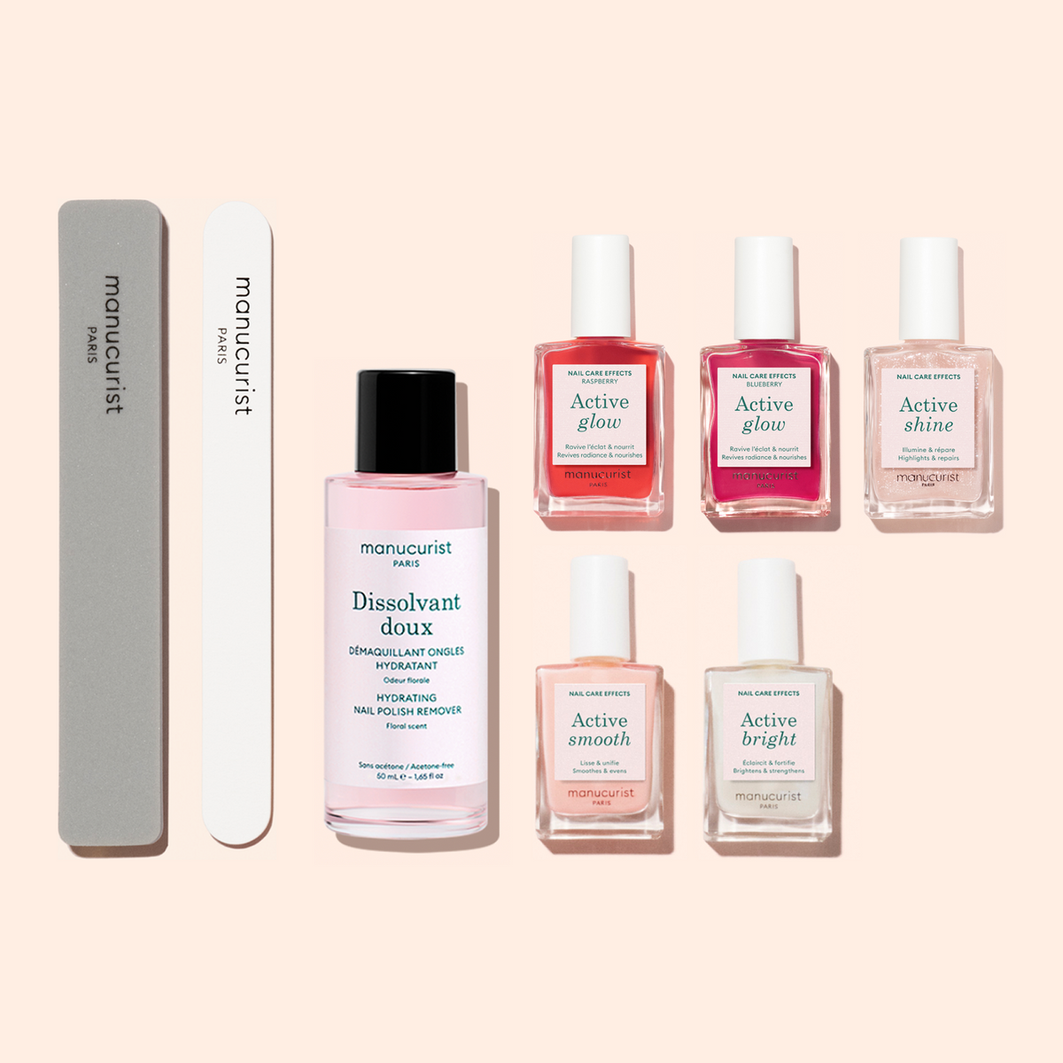 Le kit manucure Super Active de Manucurist comprend sept produits essentiels—idéals pour préparer et prendre soin des ongles—dont une lime à ongles grise, un polissoir blanc, un flacon de dissolvant rose et cinq flacons de soin aux nuances de rose, de rouge et transparentes—le tout harmonieusement disposé sur un fond clair pour vous offrir tout le nécessaire pour une manucure impeccable.