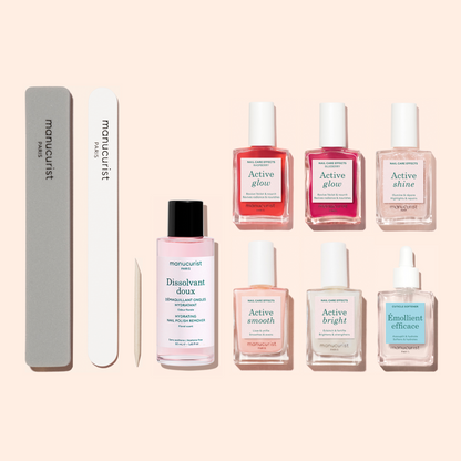Introducing the Super Active Manicure Kit by Manucurist—a complete set featuring a nail file, buffer, cuticle stick, nail polish remover, five nail care bottles, and two dropper bottles. Displayed on a light background, this kit provides everything you need for a flawless manicure and to keep your nails hydrated as part of your daily routine.