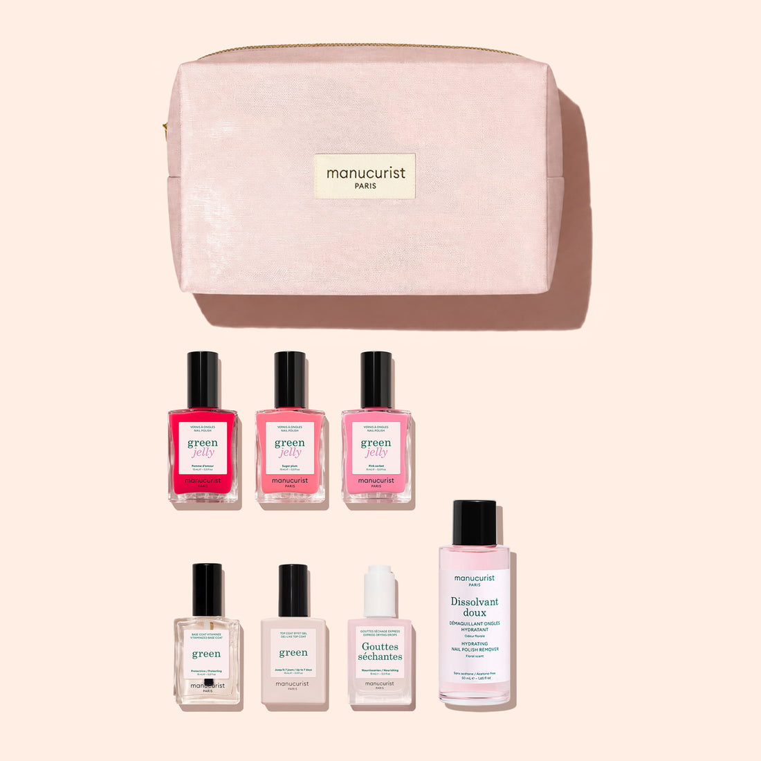 A pink toiletry bag labeled Manucurist Paris containing the Starter Kit - Jelly Nail Polish from Manucurist: seven essential nail care products, including three bottles of plant-based nail polish, a top coat, a base coat, a nail serum, and a nail polish remover—everything you need for the perfect Green manicure.