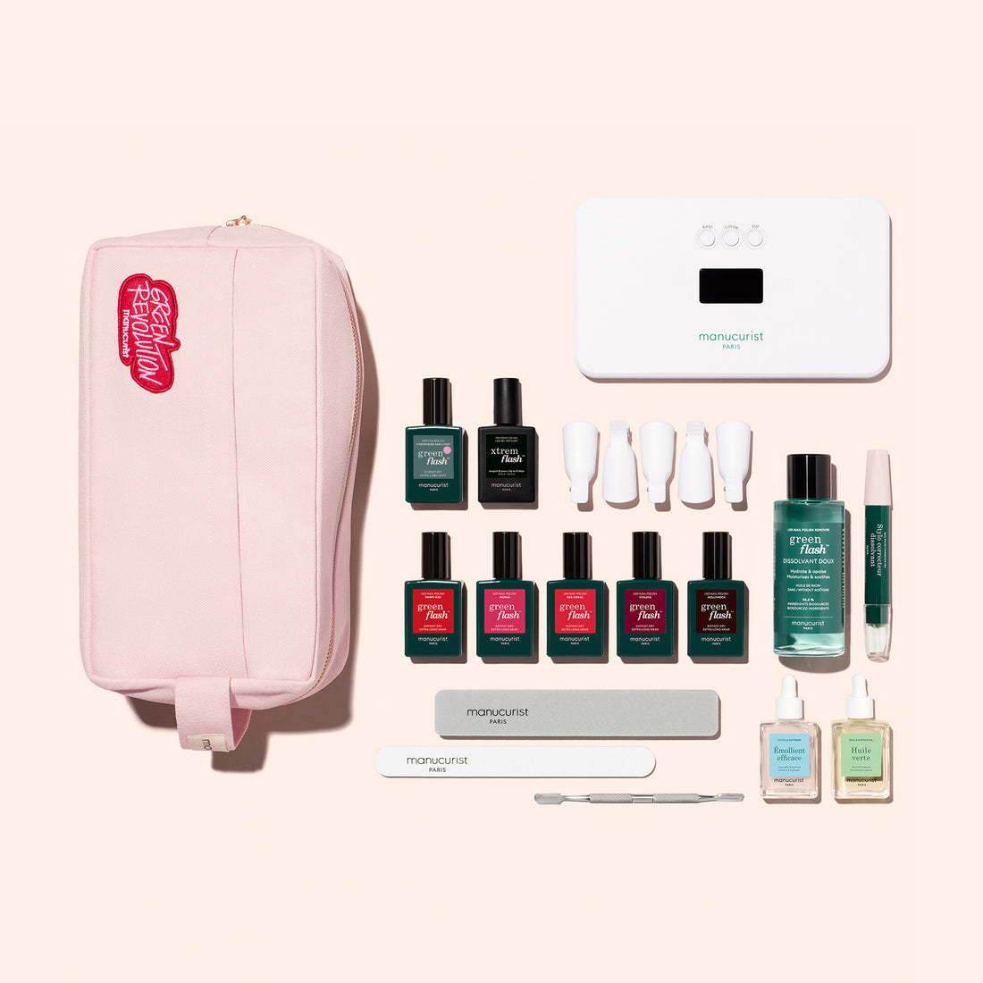 The Manucurist Super Ultimate Kit includes a pink manicure bag, UV lamp, six Green Flash gel polishes, four white caps, two files, cuticle tool, vitaminized base coat, cuticle oil, polish remover, two minis, and a pen for ultra-glossy nails.