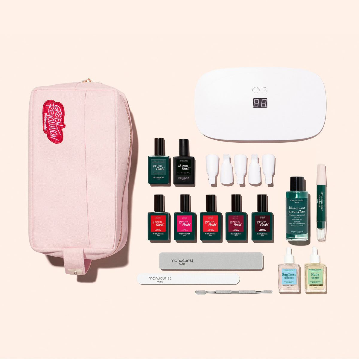Le Super Ultimate Kit de Manucurist comprend une trousse zippée rose, une lampe UV blanche, 7 vernis gel Green Flash, des limes à ongles, des accessoires pour cuticules, des flacons de dissolvant et des accessoires pour une manucure ultra-brillante, le tout élégamment présenté.