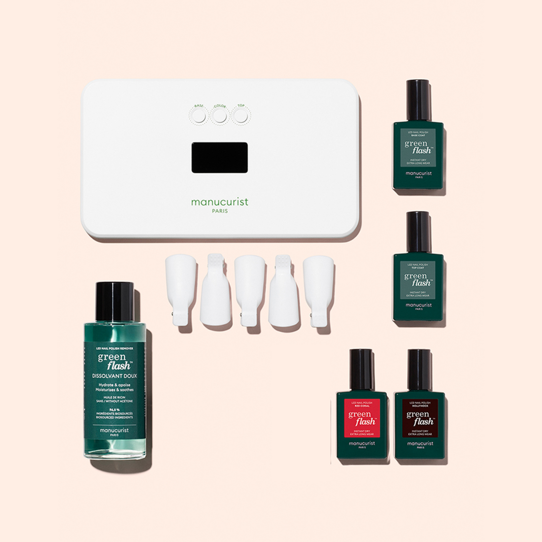 The Manucurist-test Welcome kit Green Flash includes a white LED lamp, four green polishes, gentle remover, and four white nail clips, all displayed on a light beige background.