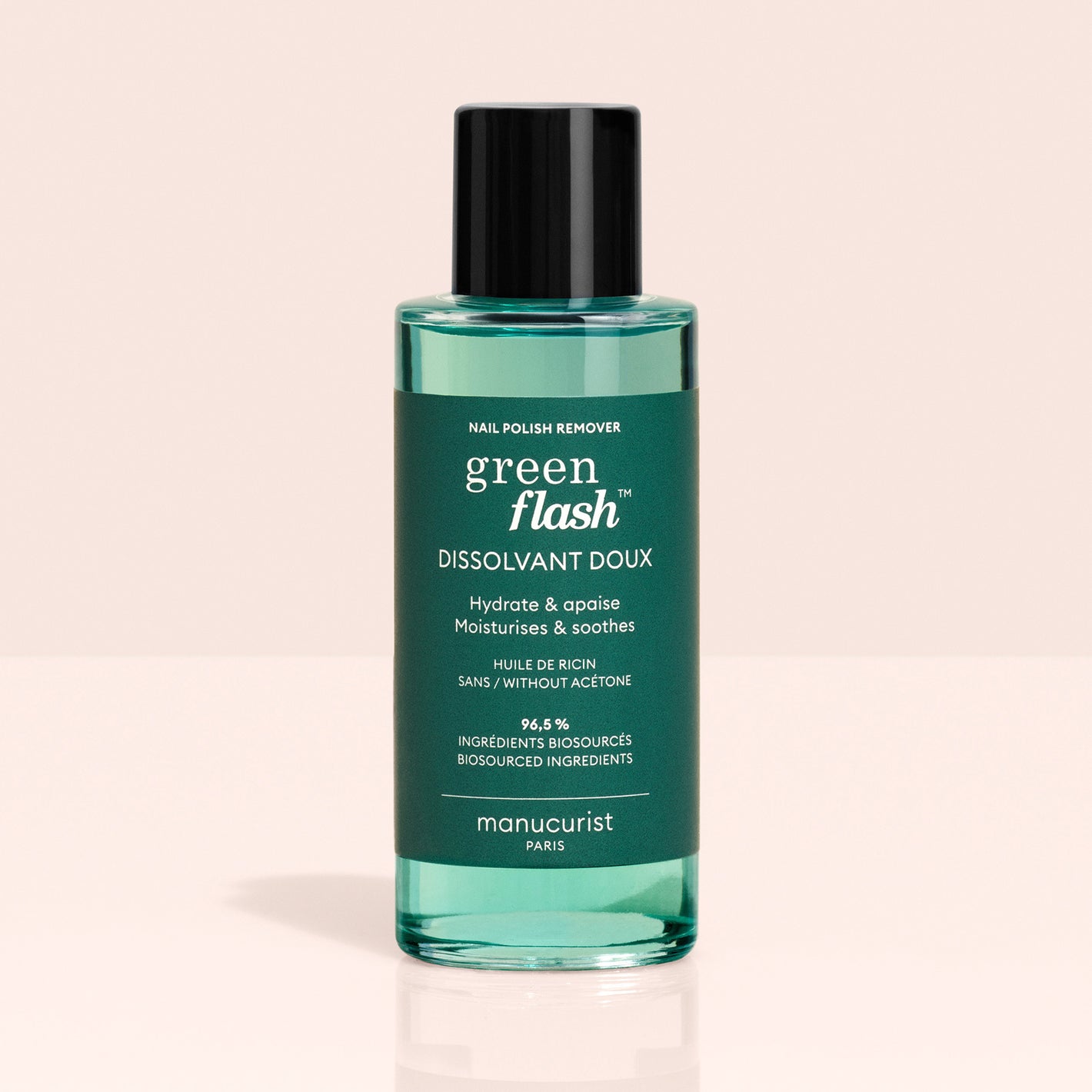 A green bottle of Green Flash™ Base Top Remover Trio by Manucurist, ideal for use with Green Flash gel polish. Acetone-free, moisturising, soothing, and made with 99.4% bio-sourced ingredients, set against a light background.