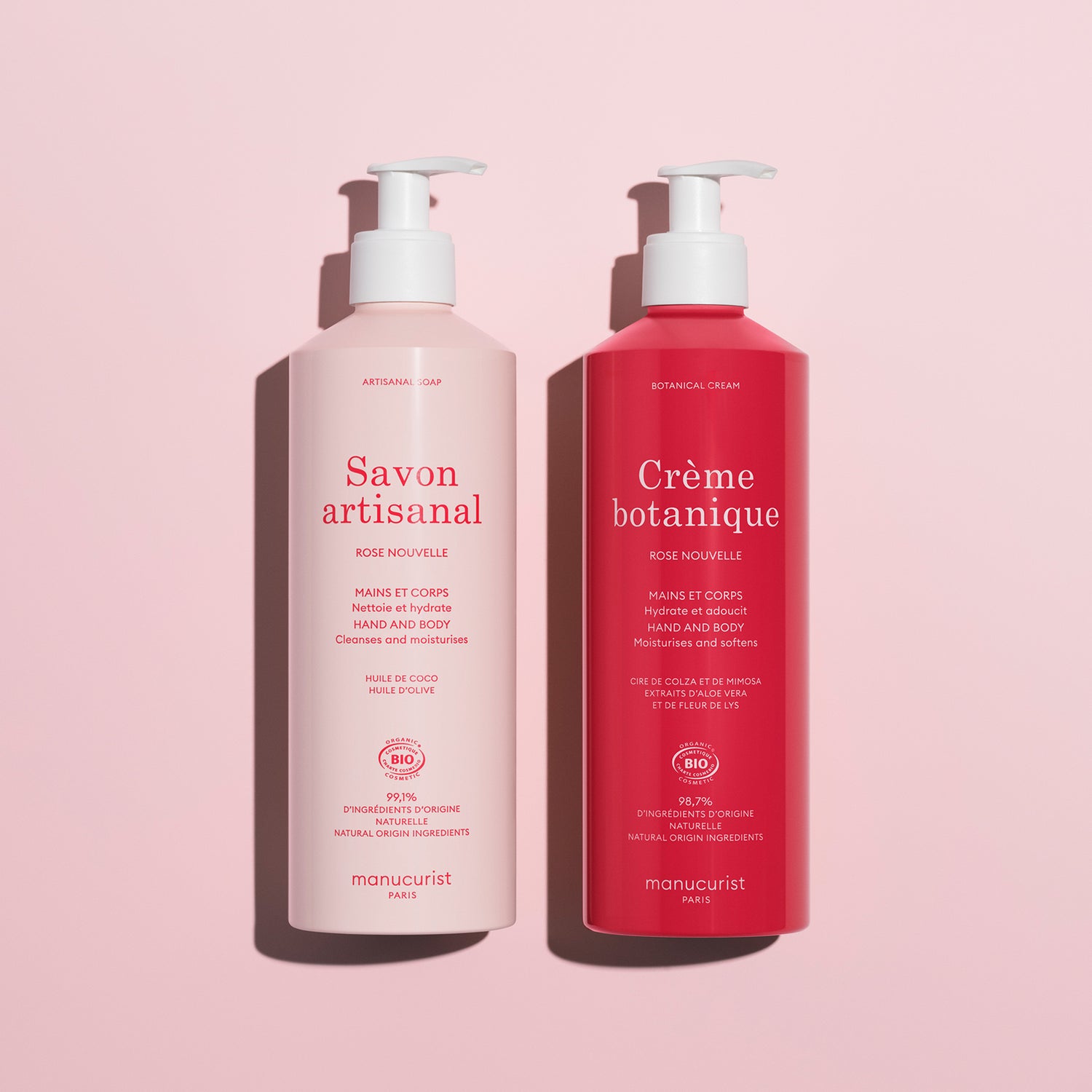 Two pump bottles on a pink background: the left is light pink labeled Savon artisanal, and the right is dark pink labeled Soothing Rose Hand  Body Cream - Cosmos Organic by Manucurist, a deeply hydrating hand and body product.