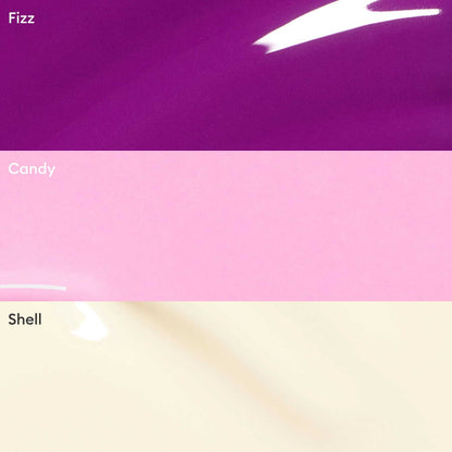 The Manucurist Curated Trios features three glossy shades—Fizz (bright purple), Candy (light pink), and Shell (pale cream)—ideal for creating on-trend color palettes.
