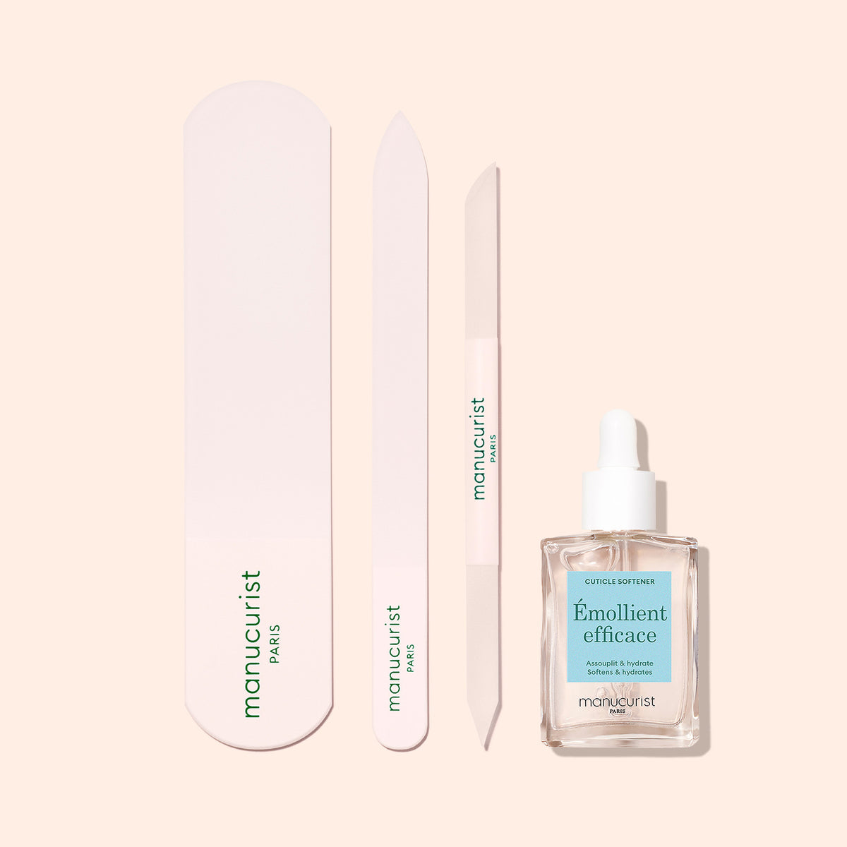 Le set Râpe pieds en verre Manucurist comprend une lime à ongles, un polissoir, un pousse-cuticules et un flacon compte-gouttes d&