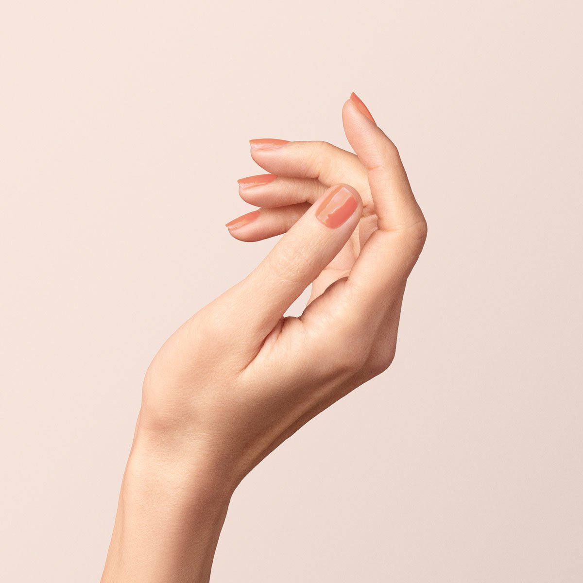 A close-up of a hand with neatly manicured nails painted in Manucurist&