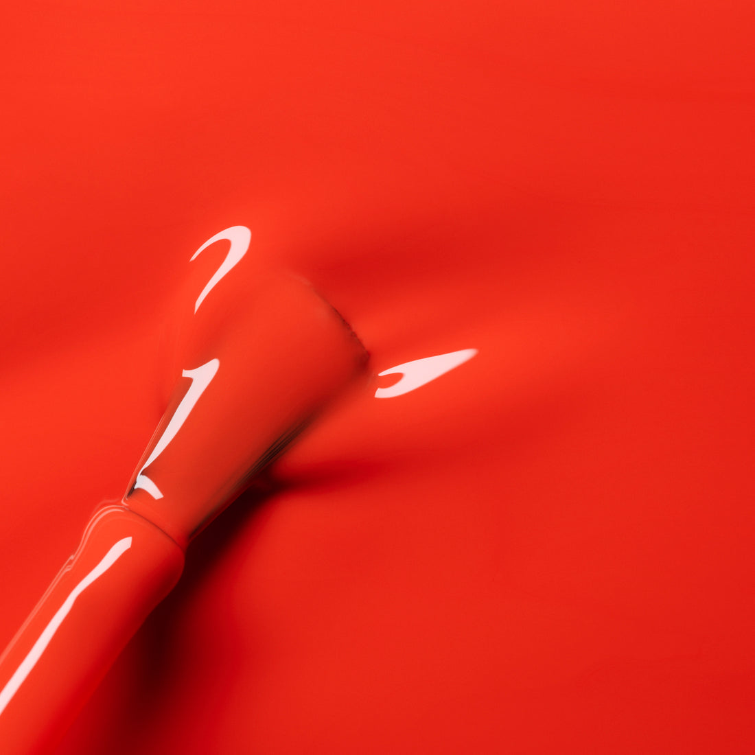 A close-up of a brush applying Manucurist&