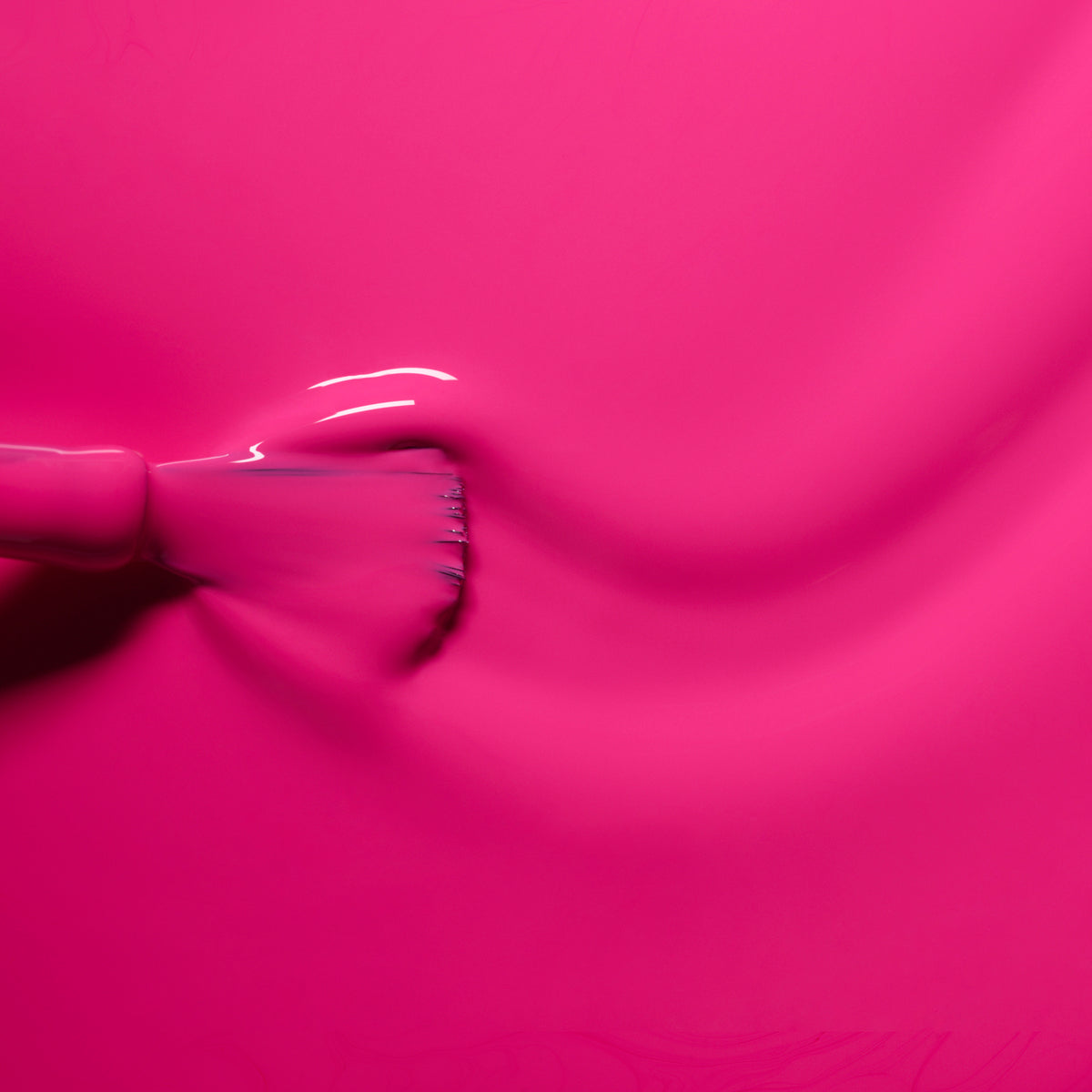 A close-up of a brush spreading Manucurist&