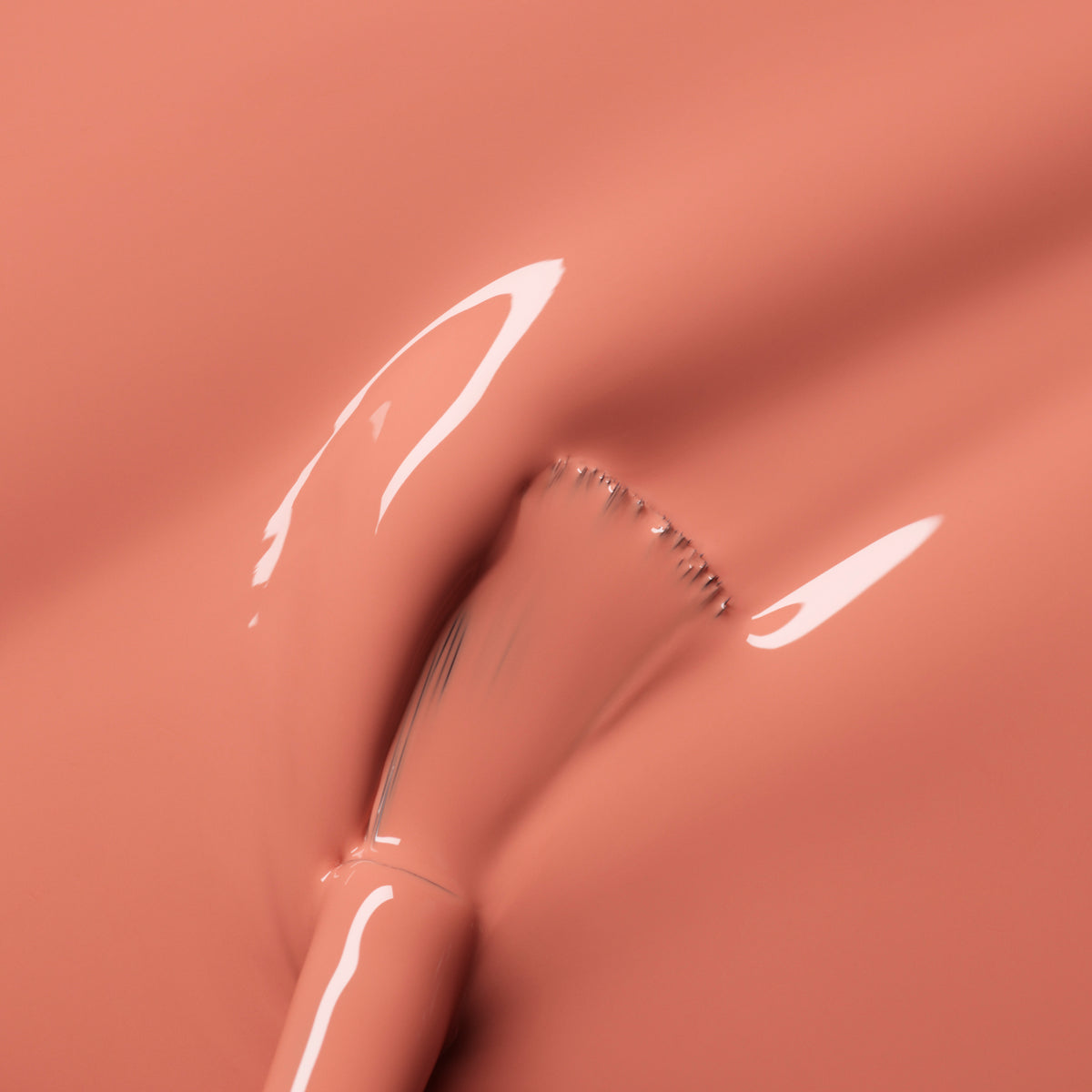 A close-up of a brush gliding through Manucurist&