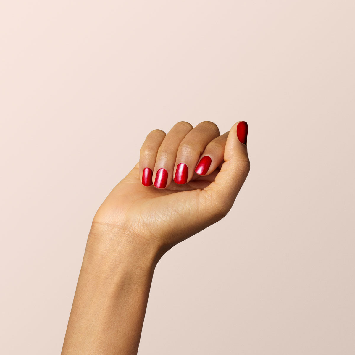 A woman's hand close-up with a new red nail manicure made of shell nail  polish. The concept of care for the skin of the hands, nails. Stock Photo |  Adobe Stock